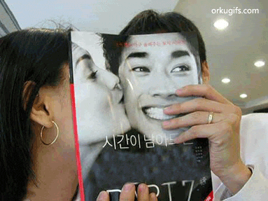Kissing through the magazine